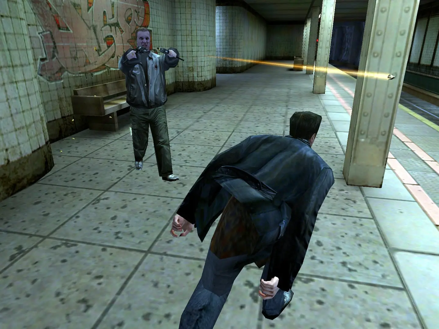 Max Payne — Max runs along a subway platform toward a man aiming a gun at him