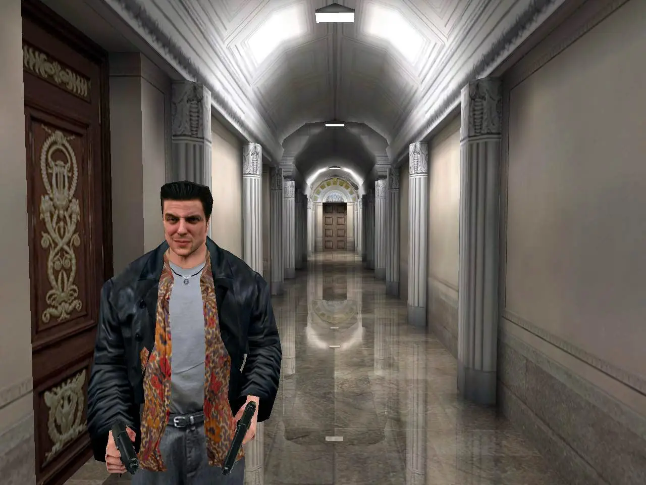 Max Payne — Max stands in a marble corridor with a pistol in each hand