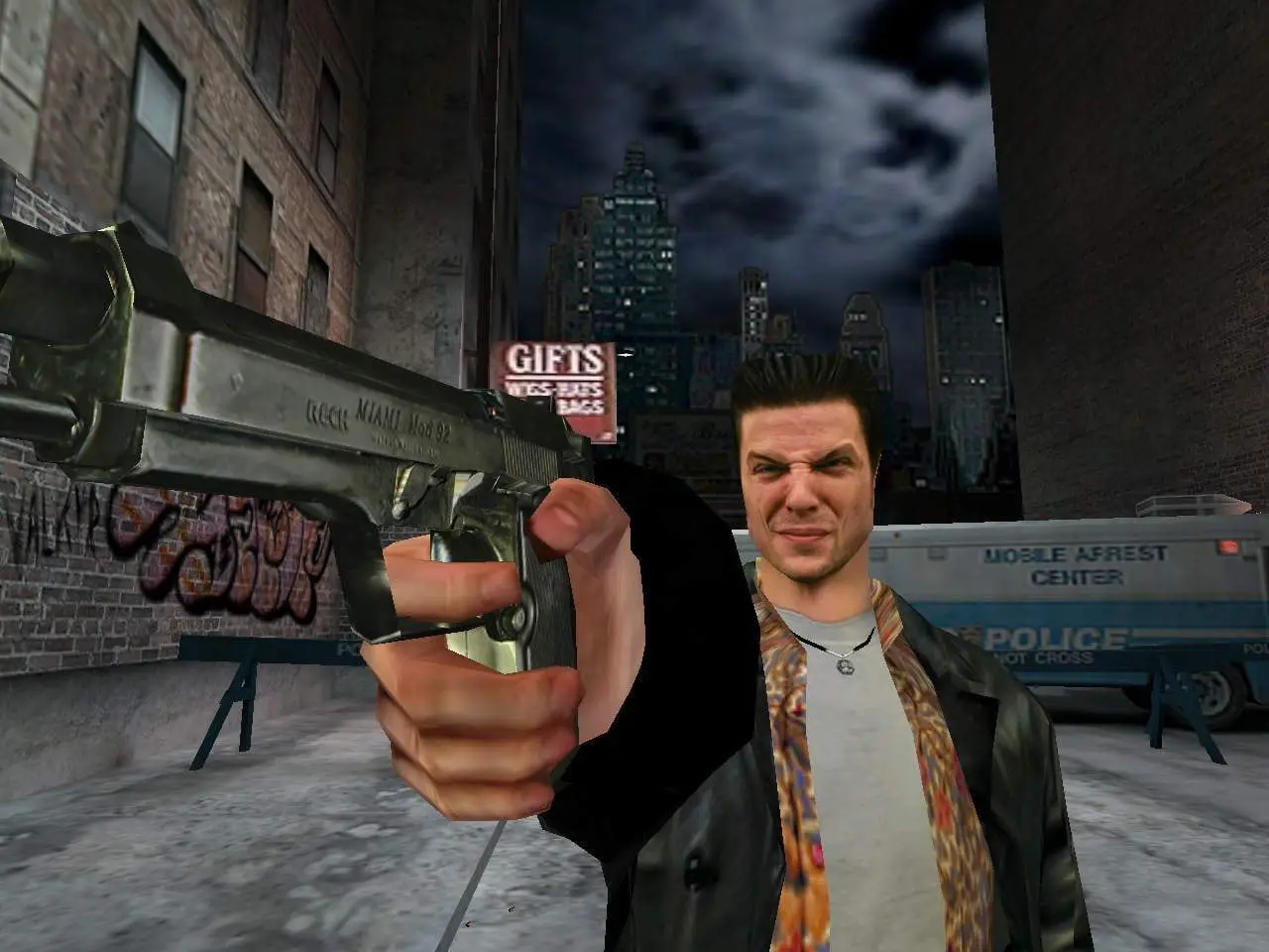 Max Payne — Max aims a pistol at the camera on the same snowy street, the police bus behind him