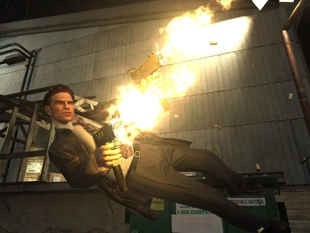 Max Payne 2: The Fall of Max Payne — Max dives past a warehouse wall firing a pistol, spent casings in the air