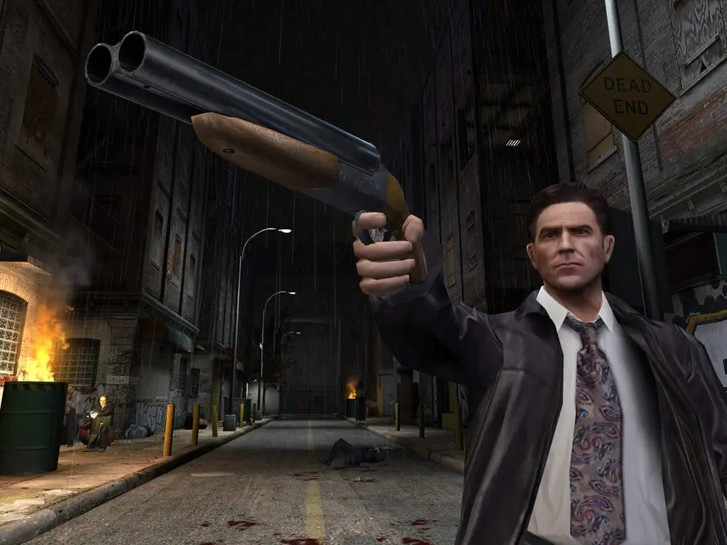 Max Payne 2: The Fall of Max Payne — Max raises a sawed-off shotgun in a night alley under a Dead End sign, fires burning behind him