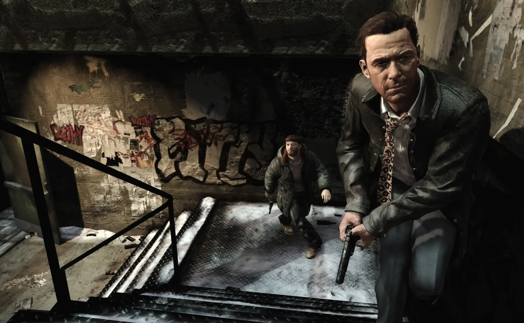 Max Payne 3 — Max in a suit climbs a stairwell with a pistol, a man following below