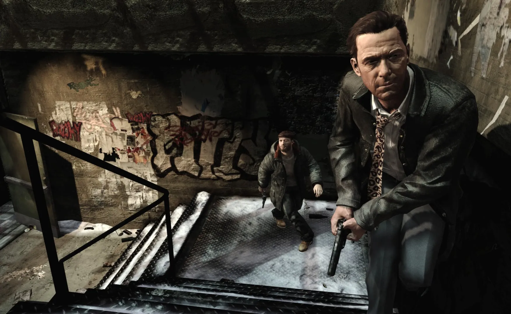 Max Payne 3 — Max in a suit climbs a stairwell with a pistol, a man following below